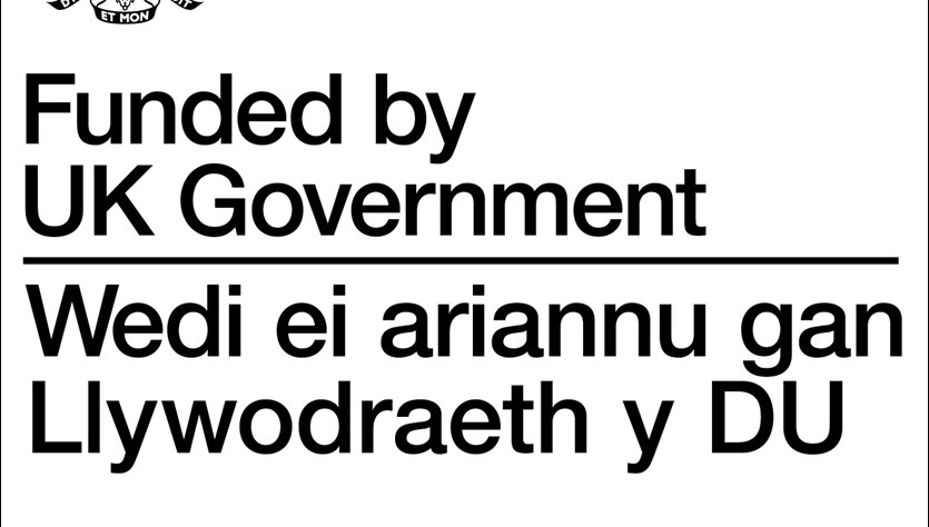 Funded By UK Government Dual Language Stacked Black Writing On White Background